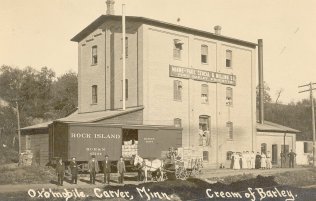 An Ox'O'Mobile in front of barley mill  Av101617